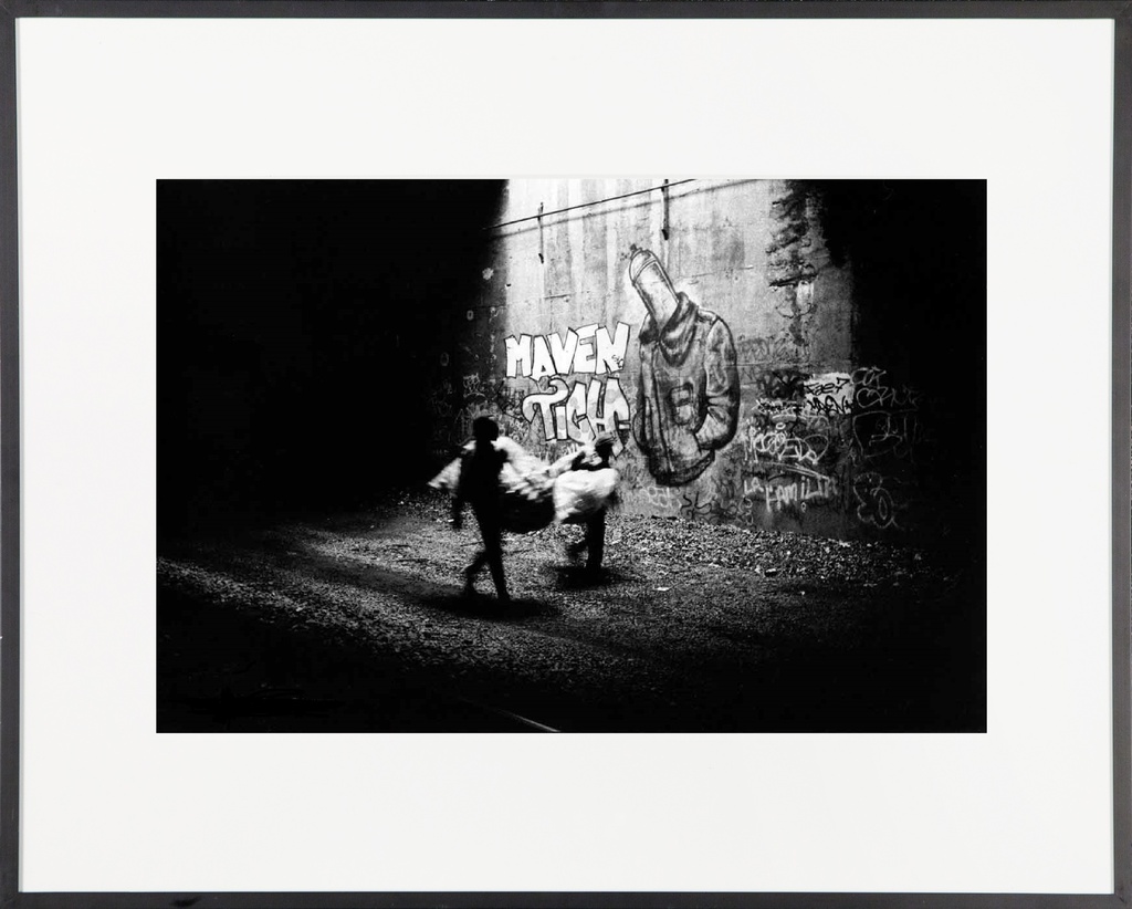 New York Tunnel People, 1994. Bernard and Tony walk underneath graffiti piece